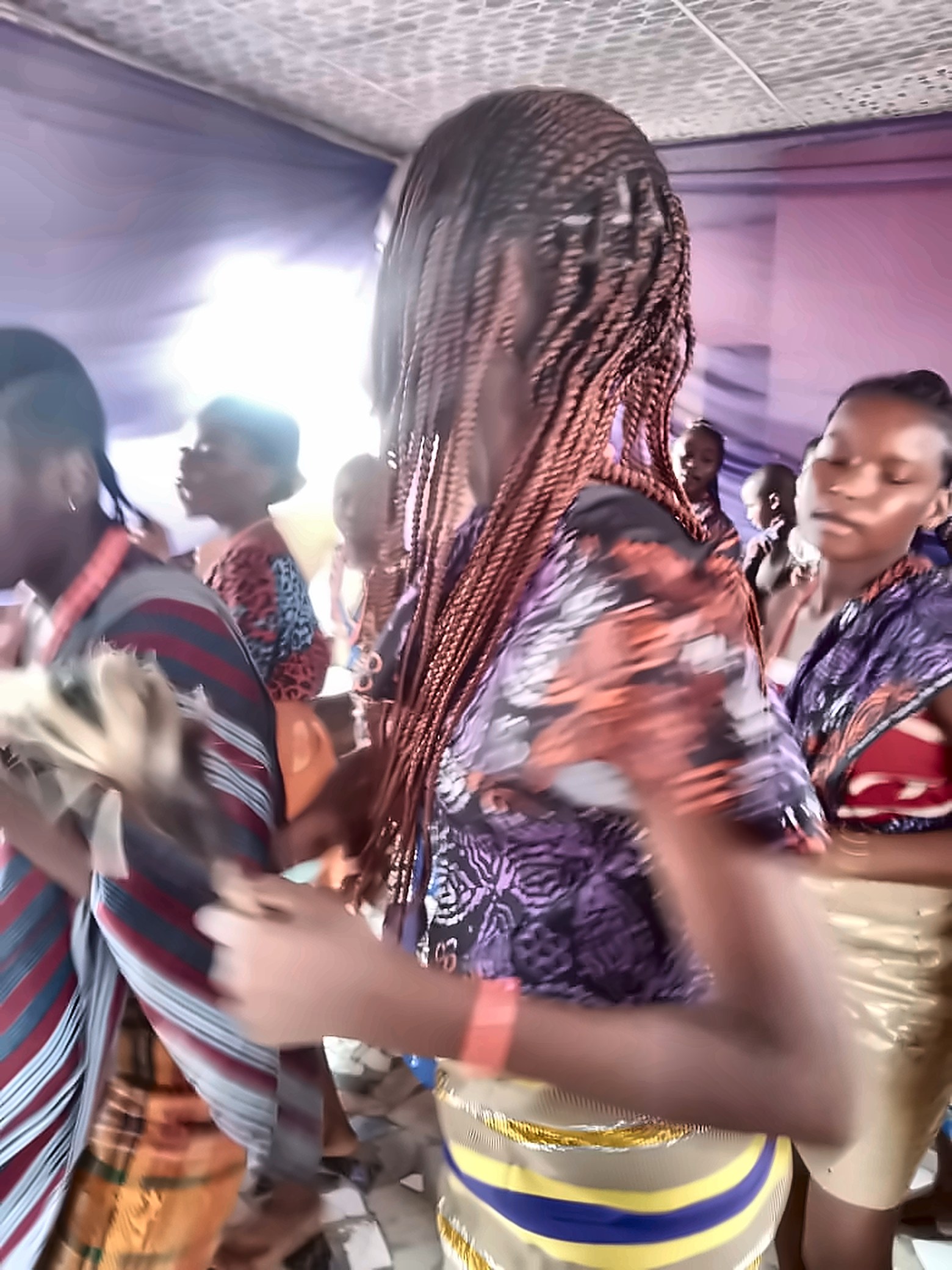 Pupils dancing in colourful attire on Cultural Day