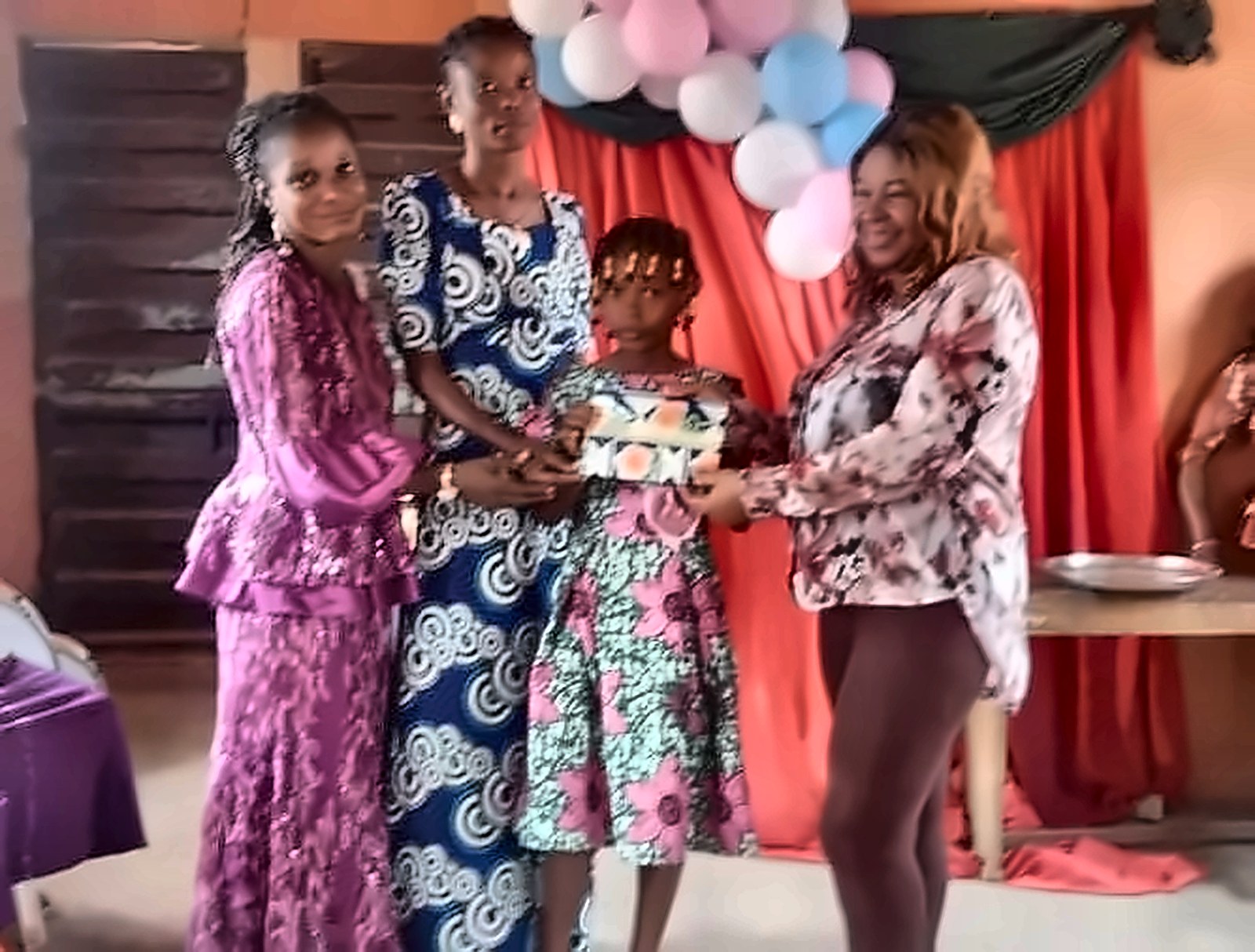 A pupil receiving a prize from staff on prizegiving day