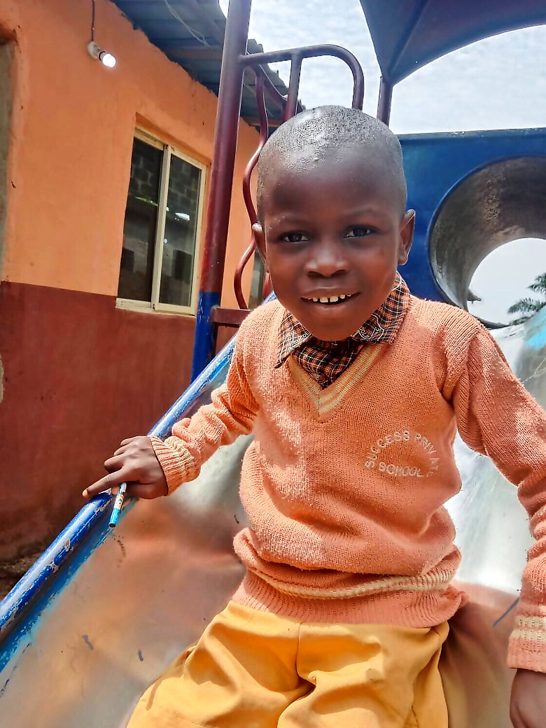 A pupil on the slide at Success Private School
