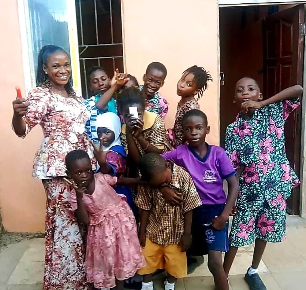 Headmistress and pupils together at Success Private School